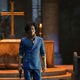 John Cho as Spike Spiegel walks through a church while holding a gun in Netflix's Cowboy Bebop Series